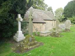 Oblique view of group of tombs c. 3m south of Vestry of Church of St. Ebba September 2016